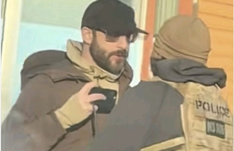 Alex Pretty holding a mobile phone while filming an encounter with ICE agents moments before he was shot.
