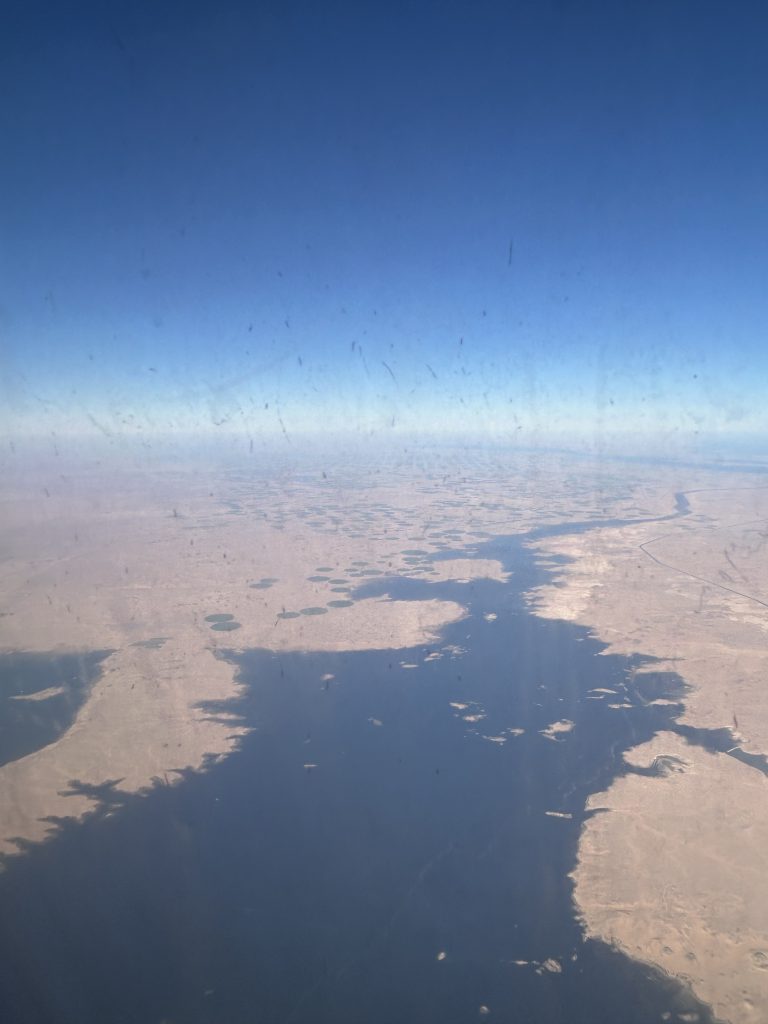 Aerial view of the Nile River creating a fertile valley through the surrounding desert landscape in Egypt