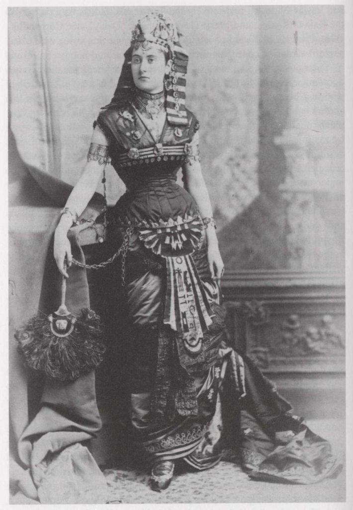 Woman in elaborate pharaonic inspired costume and jewelry orientalism portrait late nineteenth century Egypt