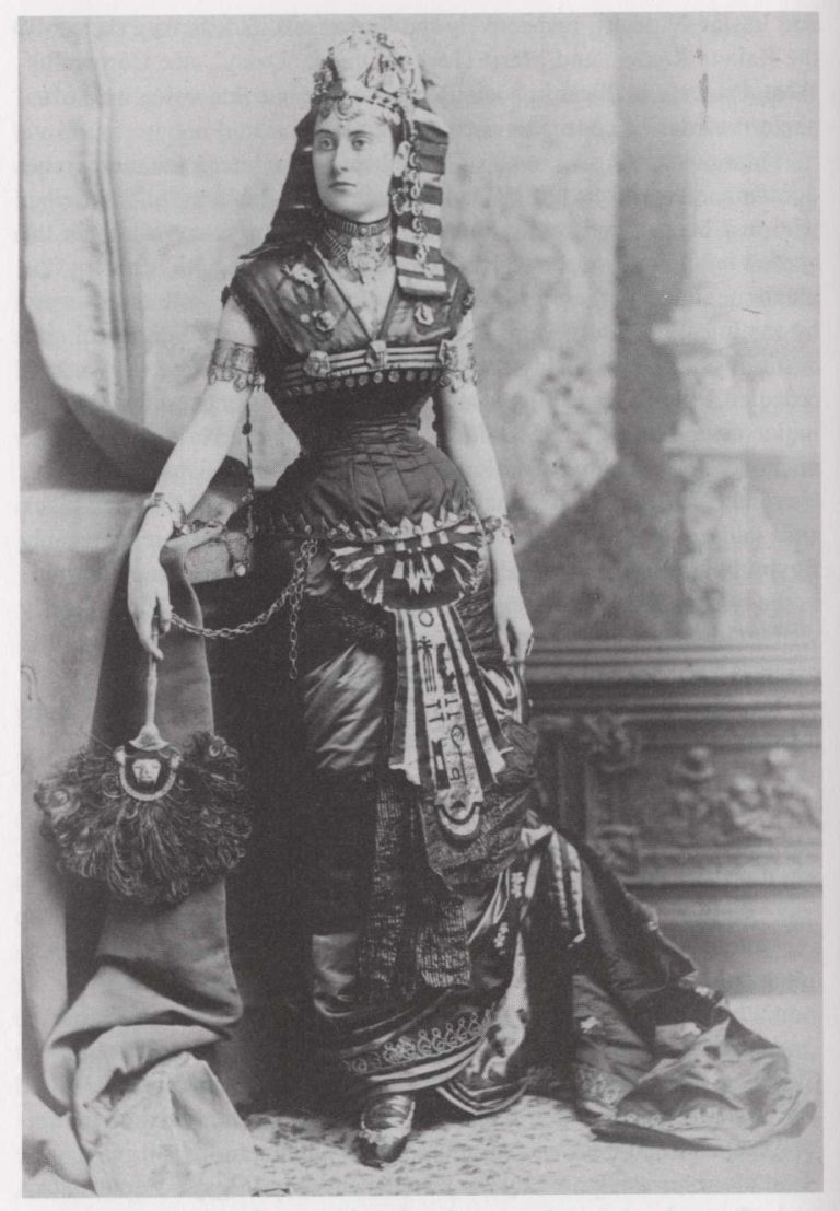 Woman in elaborate pharaonic inspired costume and jewelry orientalism portrait late nineteenth century Egypt