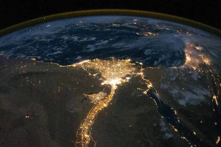 earth at night from space showing Egypt illuminated along the Nile, symbolizing civilization, continuity, and global fragility under modern geopolitical risk